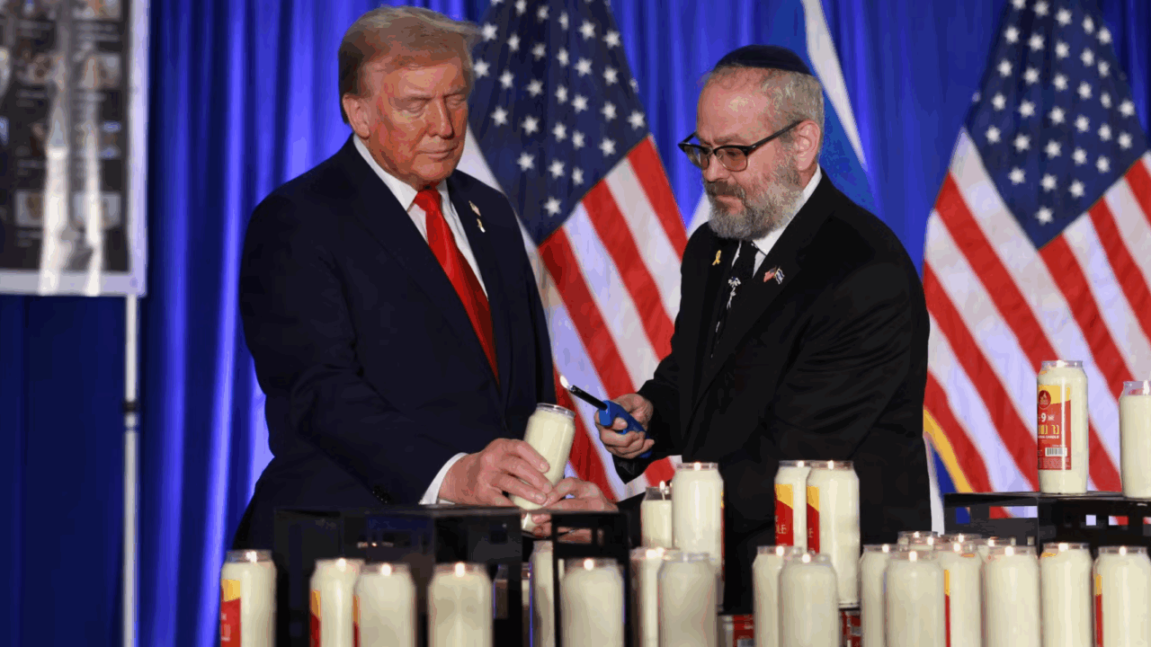 Donald Trump and Yehuda Kaploun light a candle