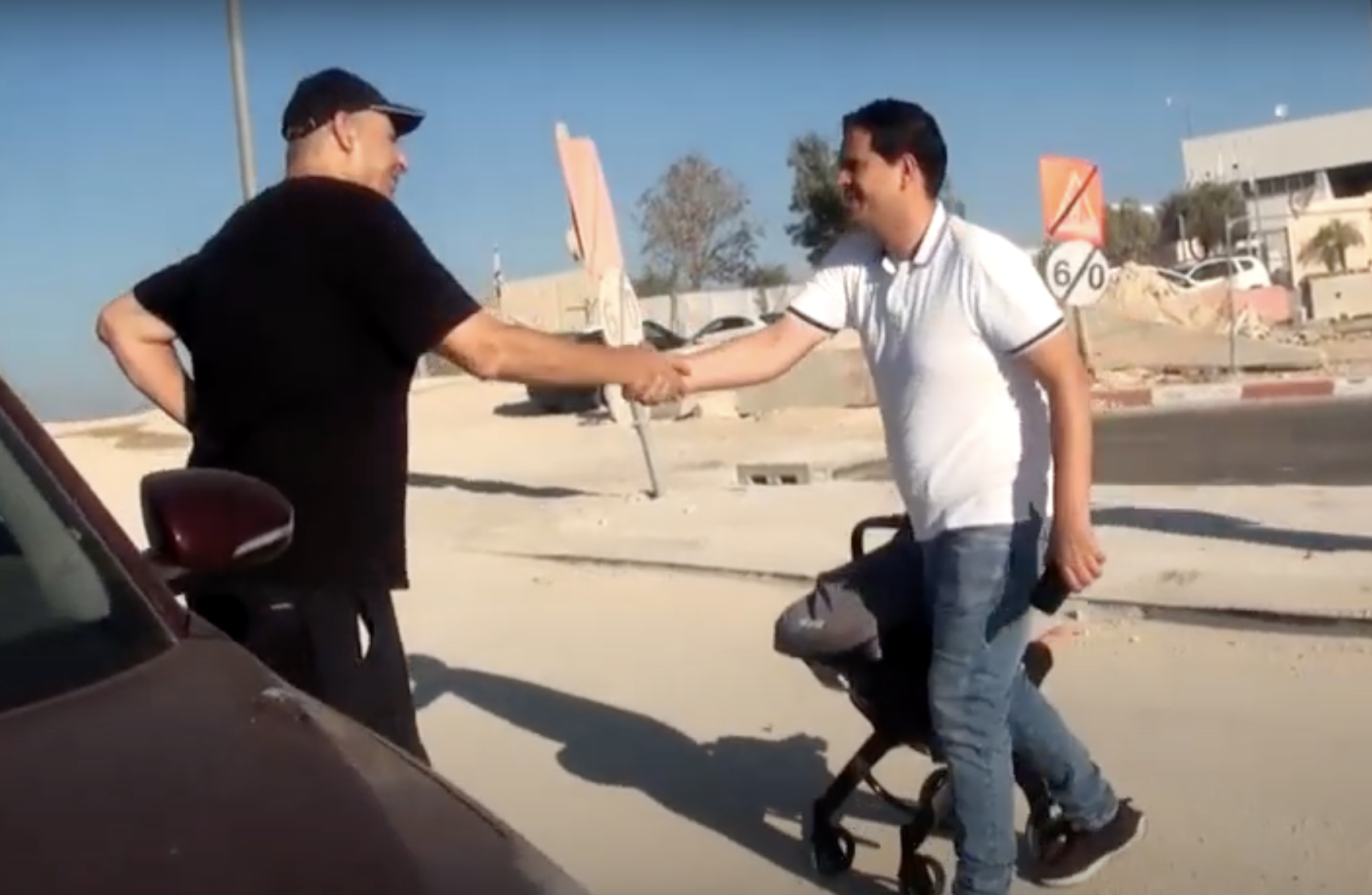 Uri Ben Seadia meets the Palestinian father of an infant who needs to travel for medical scans in Israel. (Screenshot)
