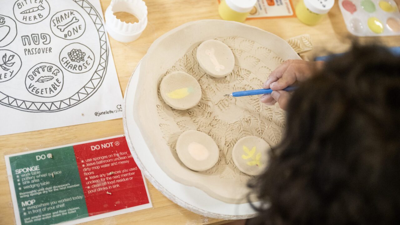 Nicole Freeling etches “Pesach” into her seder plate