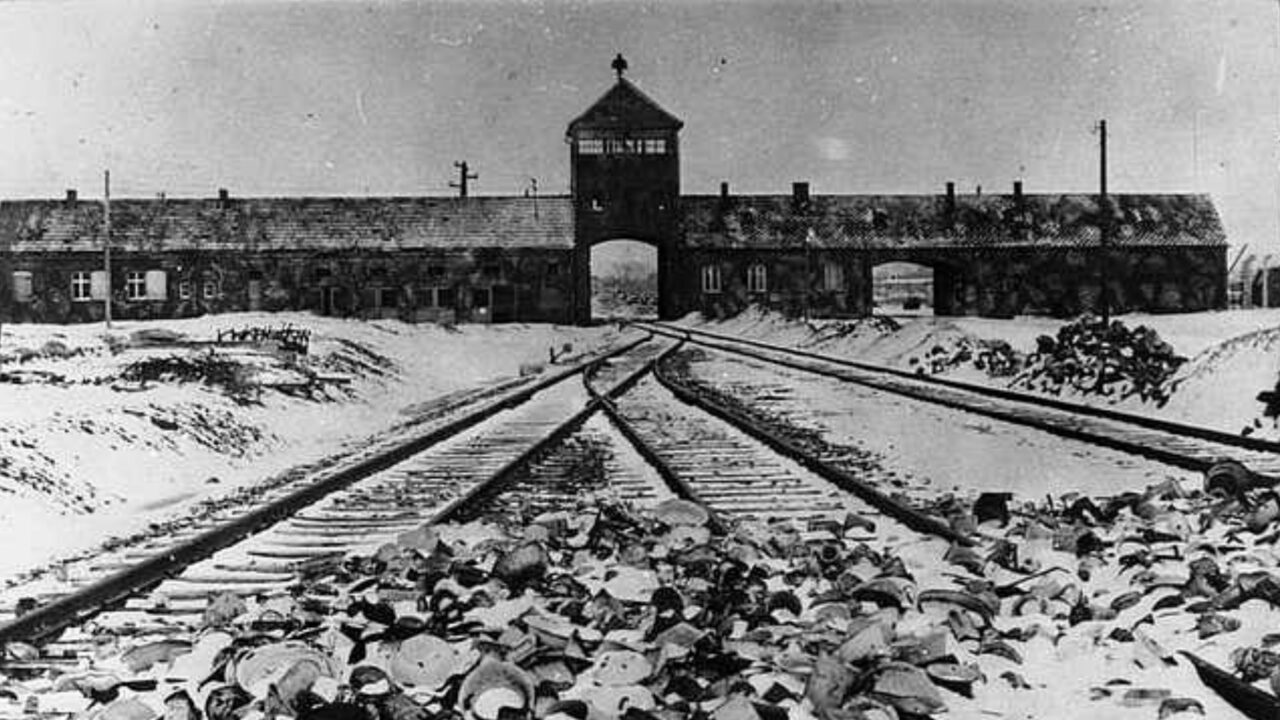 Train tracks lead to main gate of Auschwitz II-Birkenau in 1945