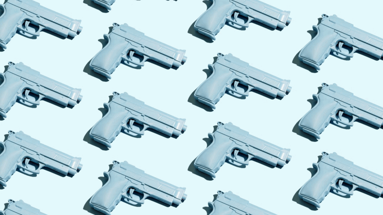 A pattern of many guns on a blue background.