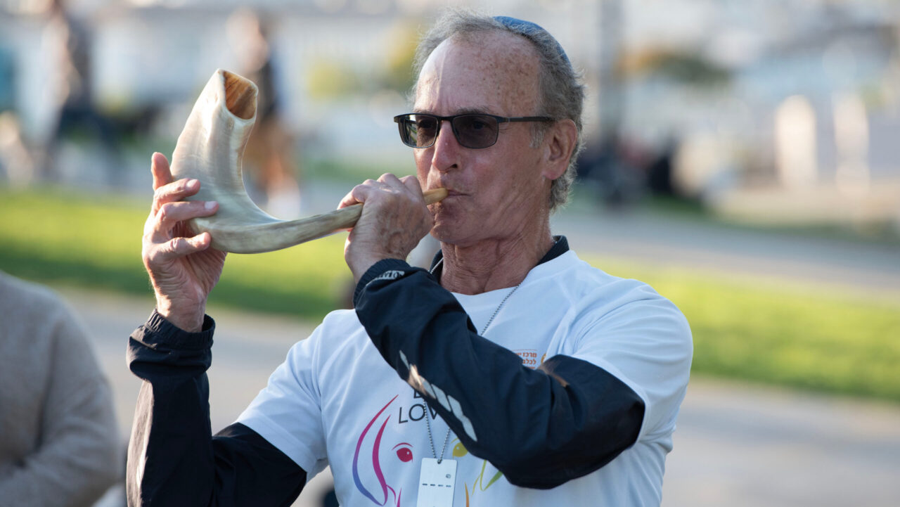 Ron Lezell blows a shofar