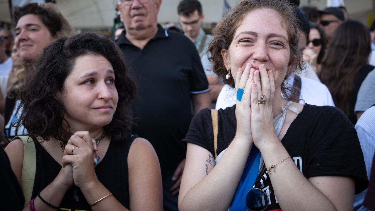 Two young women react to the release of hostages held in Gaza at Hostages Square in Tel Aviv, Oct. 13, 2025. (ELAN)