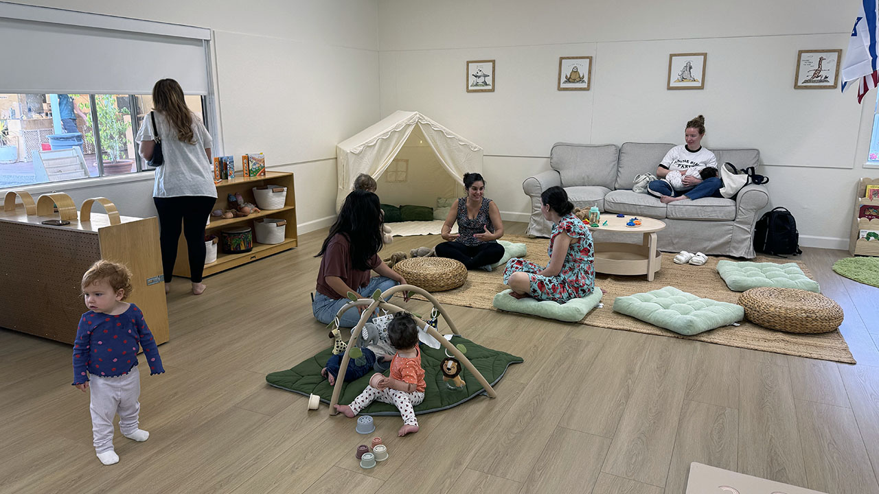 Mothers chat while their children play at Little Learners Family Center at South Peninsula Hebrew Day School in Sunnyvale. (Courtesy)