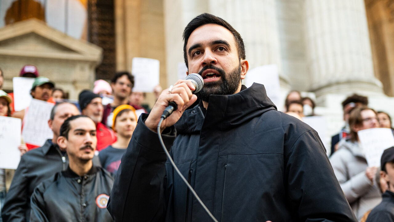 Zohran Mamdani speaking at a protest