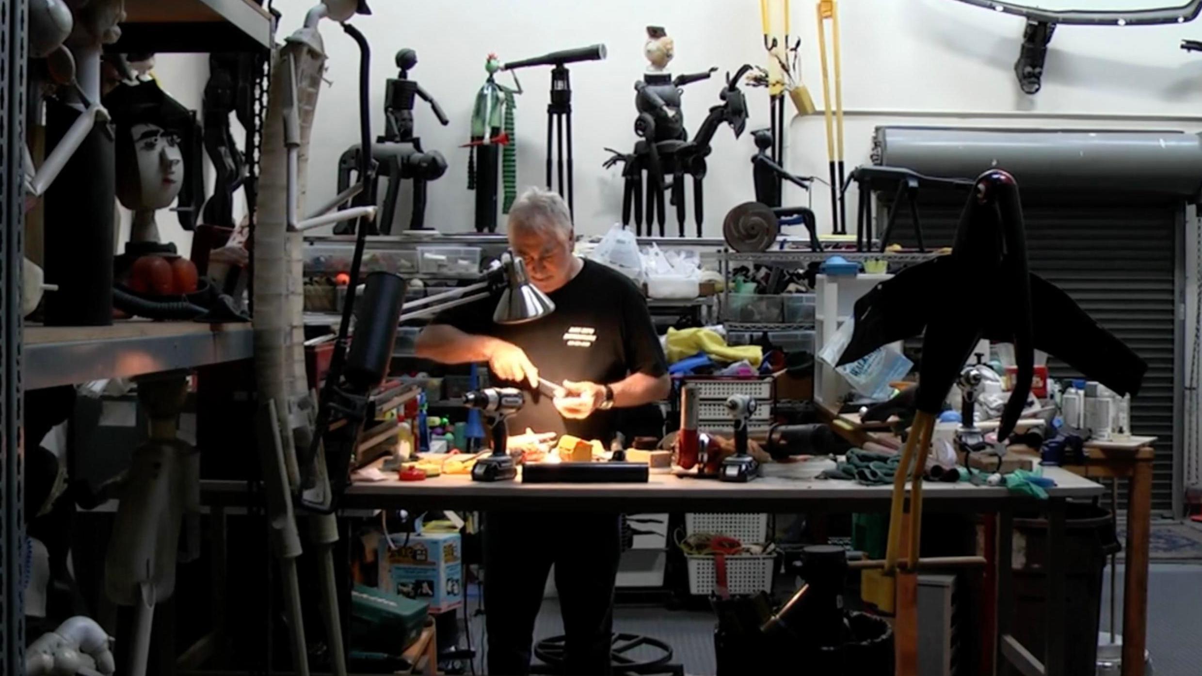 Jerry Ross Barrish in his studio in "Plastic Man." (Screenshot)