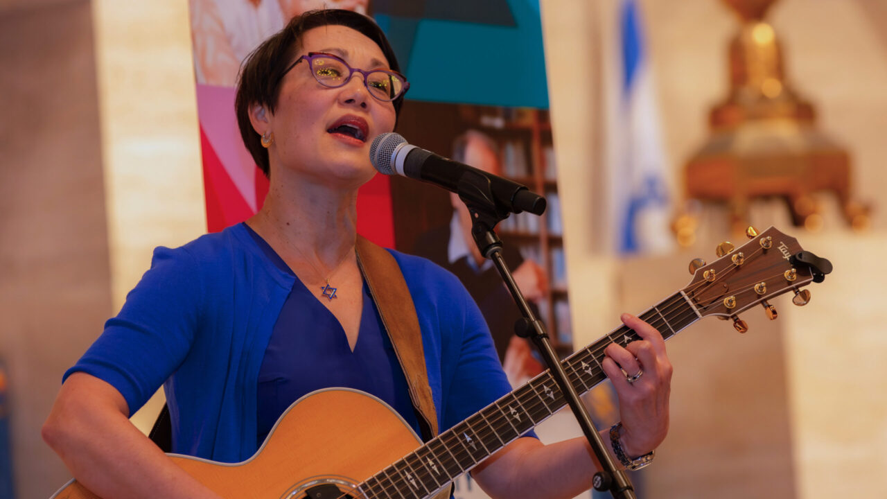 Rabbi Angela Buchdahl, who is also a cantor, performs "Over the Rainbow" at the end of her Dec. 3 event at Congregation Emanu-El in San Francisco. (Courtesy JCCSF/Justin Halgren)