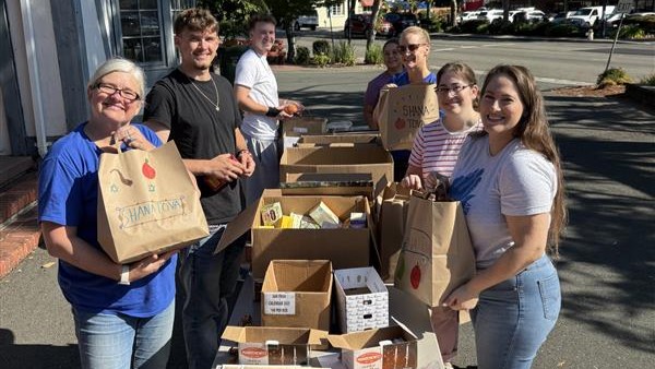 JFCS East Bay staff and volunteers assemble some of the more than 200 meals and supplies for Rosh Hashanah that were delivered across Alameda and Contra Costa counties in September. (Courtesy JFCS East Bay)