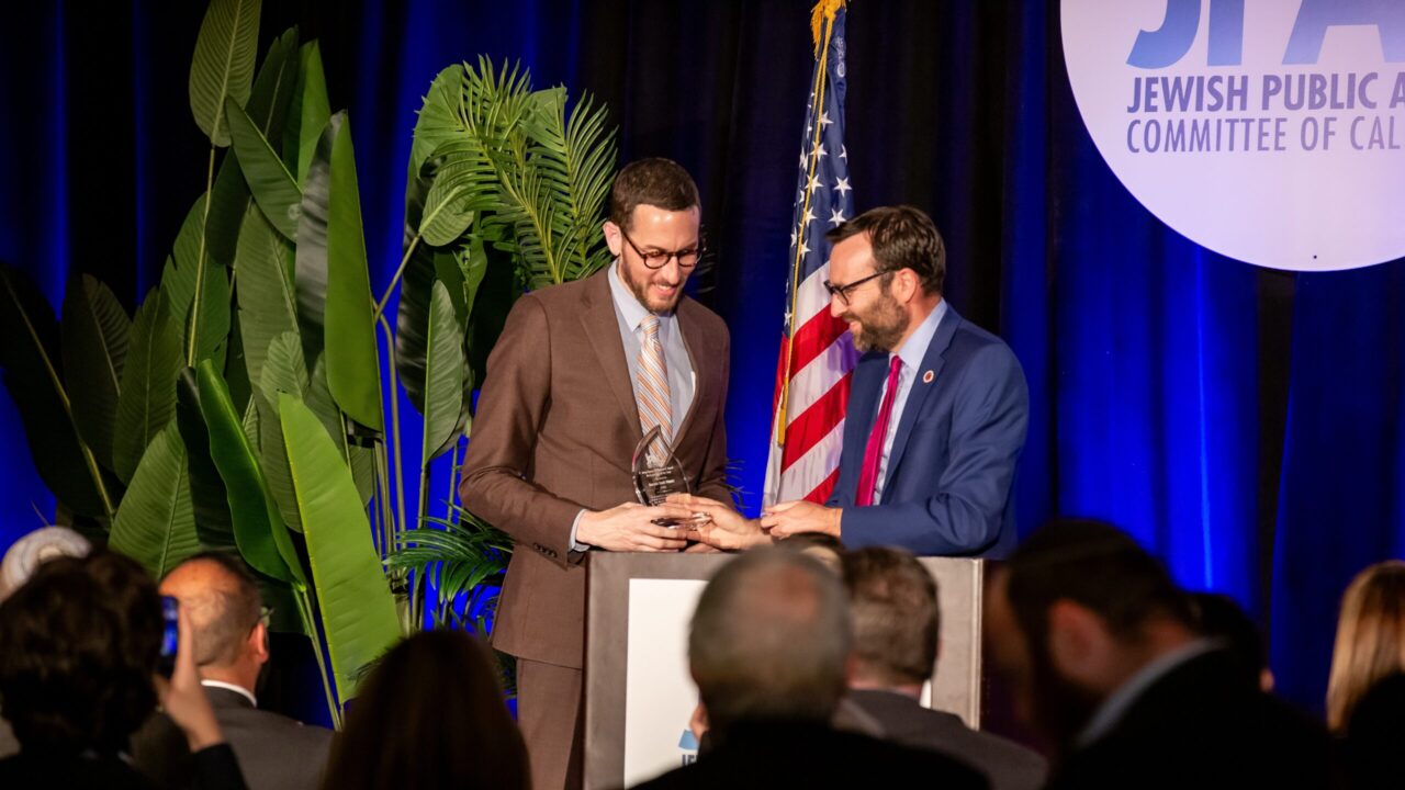 State Sen. Ben Allen (right) presents state Sen. Scott Wiener with the Jewish Public Affairs Committee of California's Jerry Sampson Memorial Award for Legislator of the Year during during JPAC's 2025 legislative summit on May 5 in Sacramento. (Camden Hosea-Small)