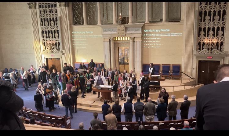 Interfaith clergy join together on the bimah at Temple Israel in Minneapolis on Jan. 23. (Courtesy of Rabbi David Cooper)