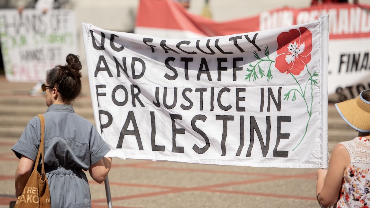 Demonstrators hold a UC Faculty and Staff for Justice in Palestine sign during a protest at UC Berkeley in August 2024. (Aaron Levy-Wolins/J. Staff)