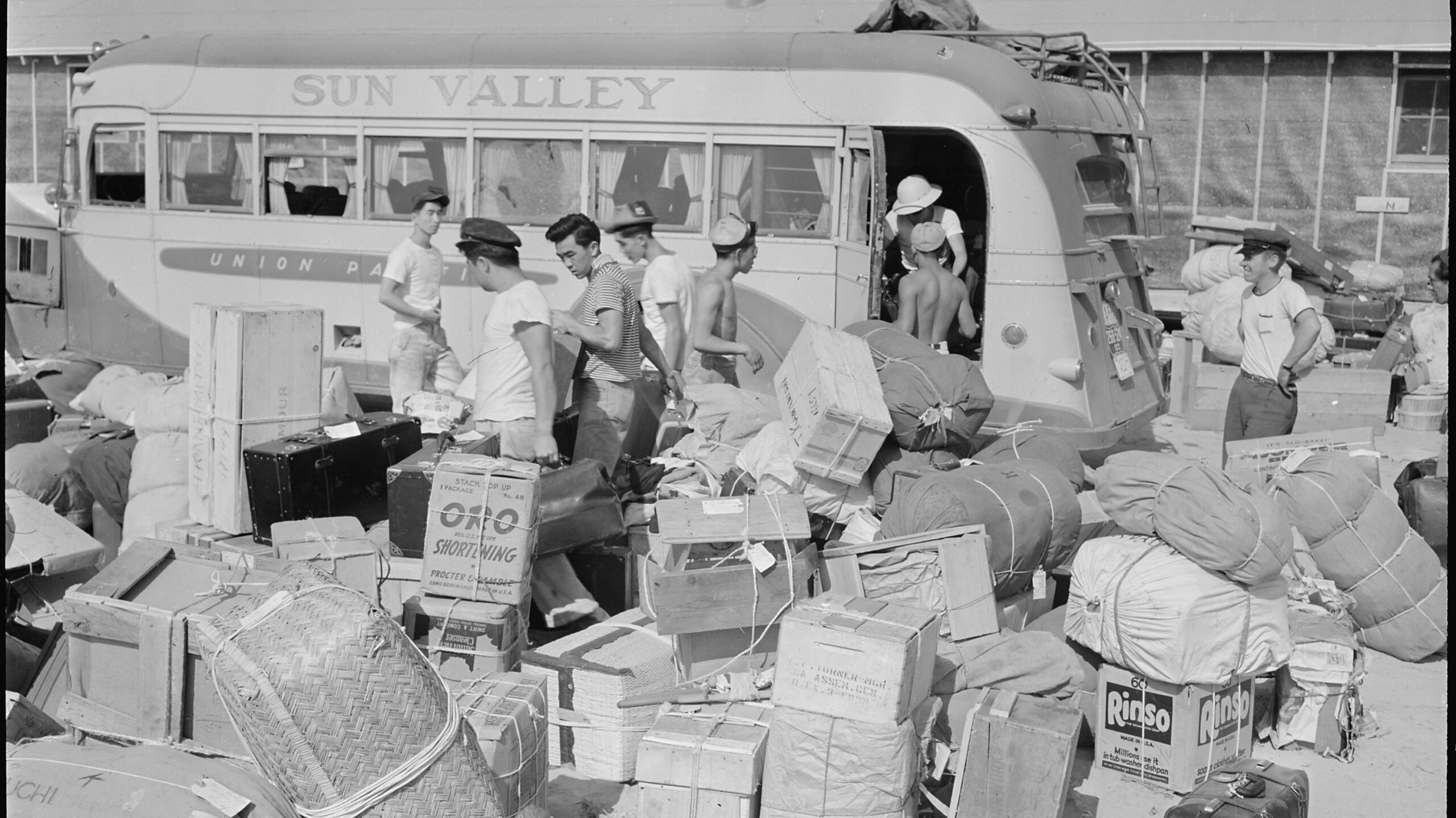 Baggage belonging to evacuees from the assembly center at Puyallup, Washington, being sorted, 1942. (National Archives)
