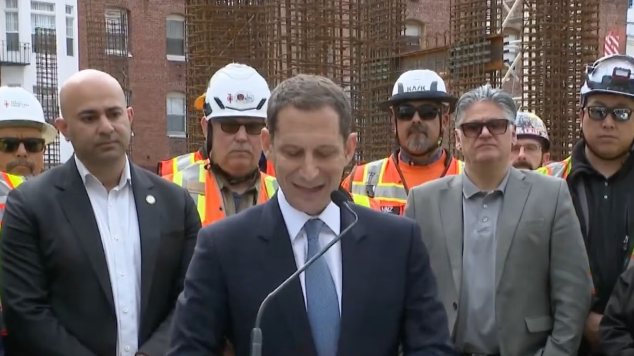 San Francisco Mayor Daniel Lurie delivers a press conference during which a disruptor chanted "tax the Jews." (Screenshot via YouTube)