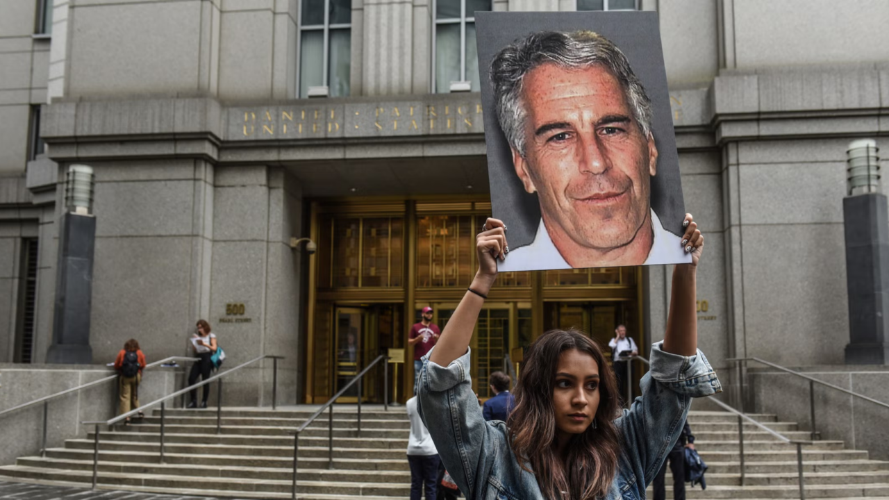 Protestor with Epstein sign