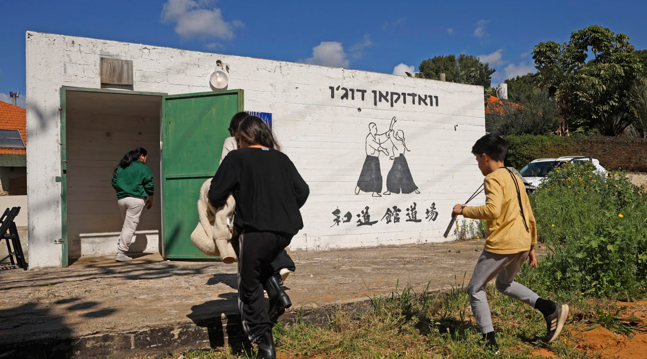 Israelis race for shelter amid reports of incoming missiles from Iran on Feb. 28, 2026 in Pardes Hanna-Karkur, Israel. (Amir Levy/Getty Images)