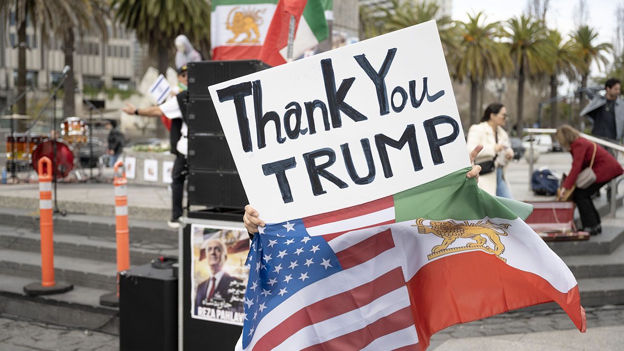 A supporter of U.S. and Israeli military strikes on Iran holds a sign that says “Thank you Trump” during a rally celebrating the killing of Ayatollah Ali Khameini at Harry Bridges Plaza in San Francisco, March 1, 2026. (Aaron Levy-Wolins/J. Staff)