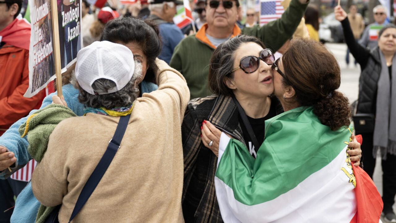 Iran demonstrators kiss