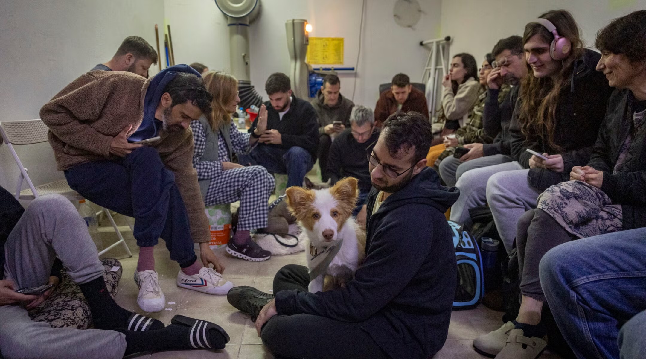 Israelis take cover in a public shelter in Tel Aviv as a siren sounds warning of incoming ballistic missiles fired from Iran toward Israel, March 1, 2026. (Chaim Goldberg/Flash90)