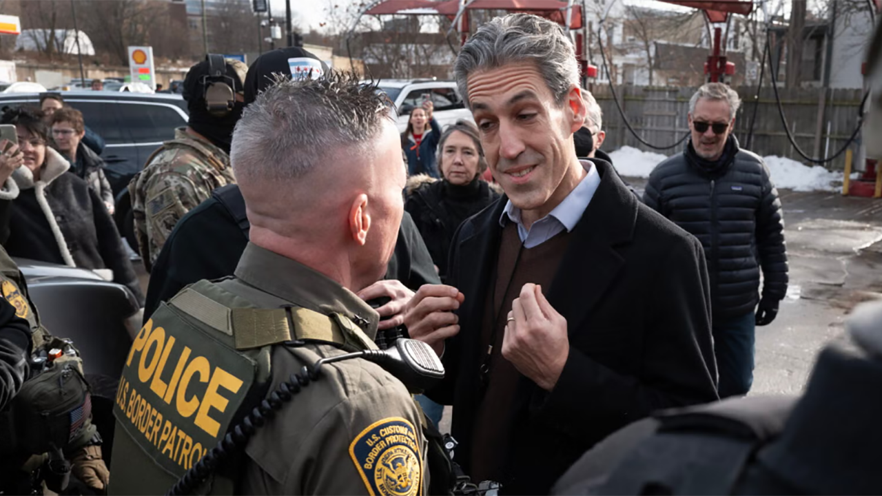 Evanston mayor and congressional candidate Daniel Biss, right, confronts U.S. Border Patrol Chief Gregory Bovino in Evanston, Illinois, Dec. 17, 2025. (Scott Olson/Getty Images)