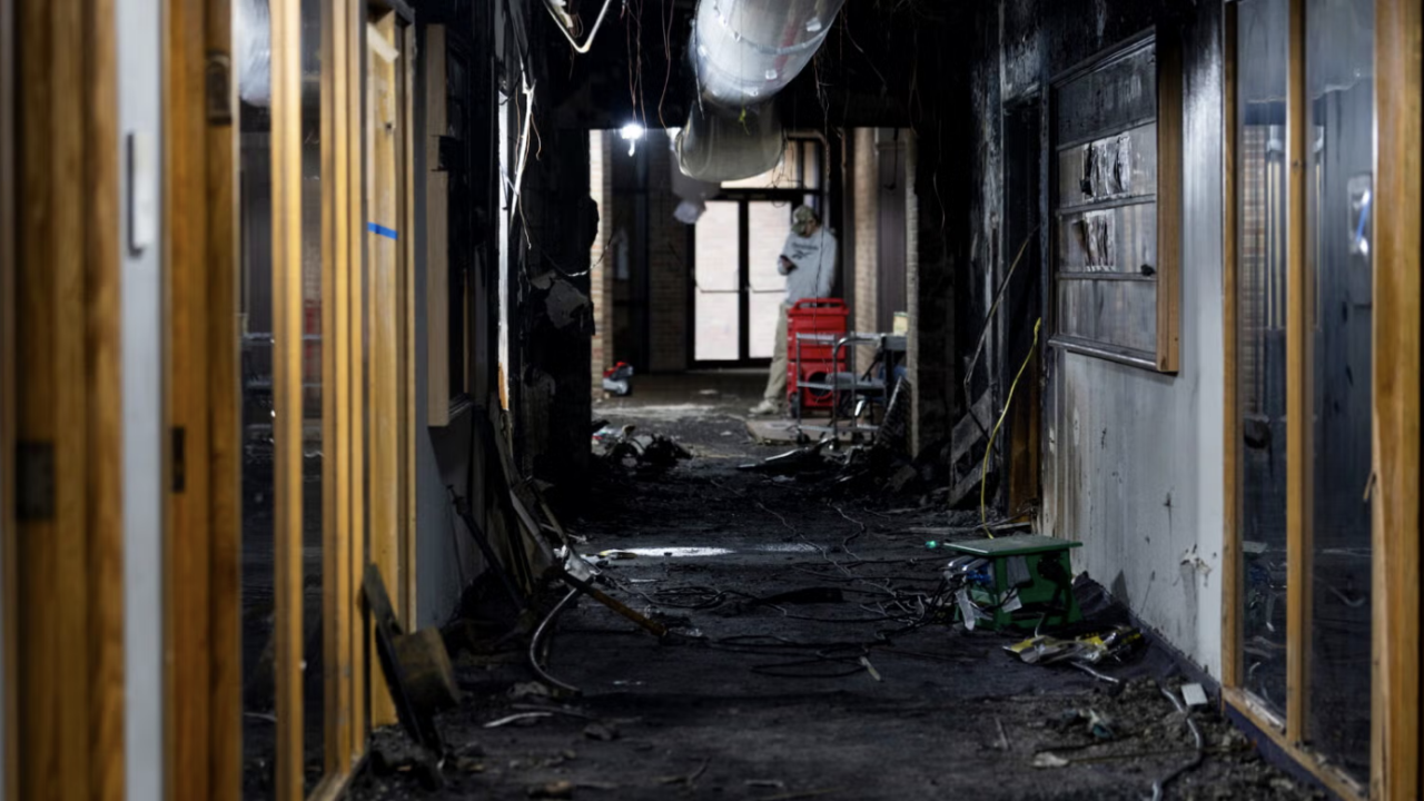Extensive damage is visible inside the charred hallway at Temple Israel where an attacker drove his vehicle into the building entrance next to the early childhood center on March 12. This photo was taken on March 16. (Emily Elconin)