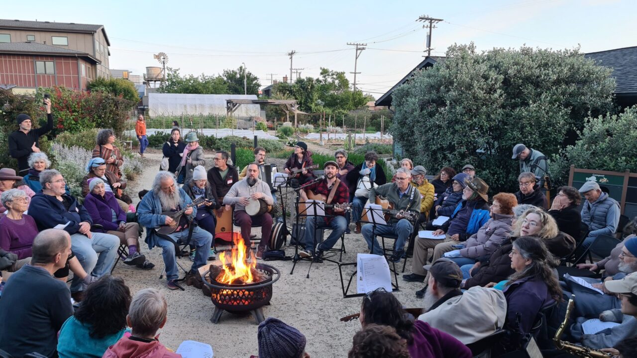 Community members sing during a Lag Ba’Omer bonfire at Urban Adamah in Berkeley. (Courtesy Sacred Music Fellowship)
