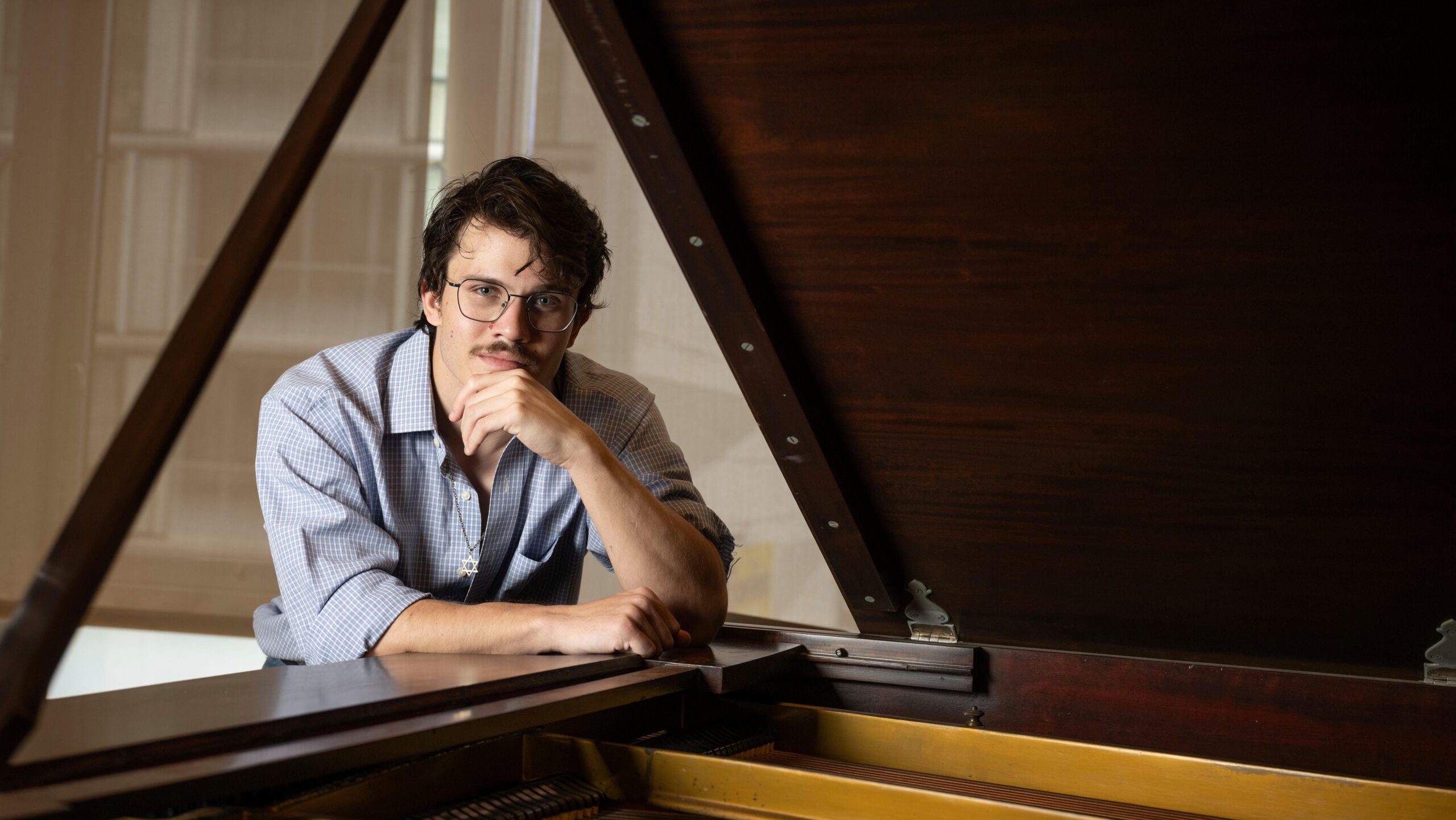 Alex Malinas, 23, poses for a photo at the San Francisco Conservatory of Music, April 22, 2026. (Aaron Levy-Wolins/J. Staff)