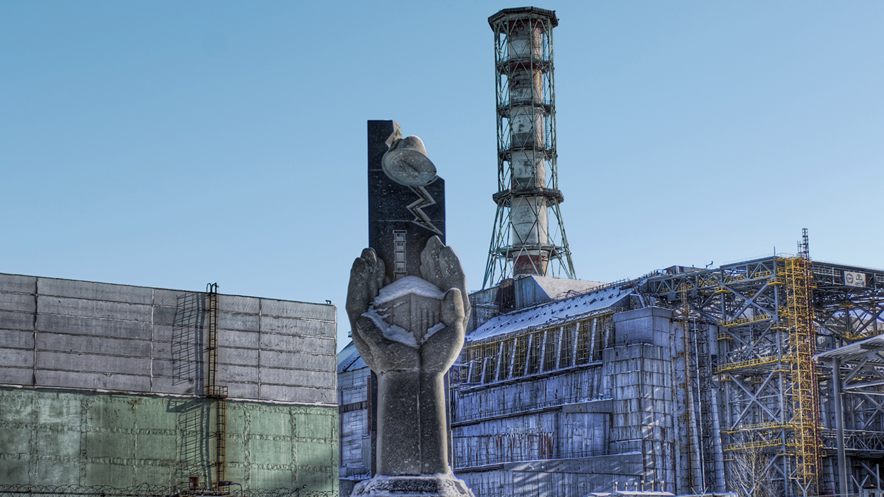 A memorial stands near the entombed reactor of the Chernobyl nuclear power plant. (Trey Ratcliff CC BY-NC-SA 2.0 via Flickr)