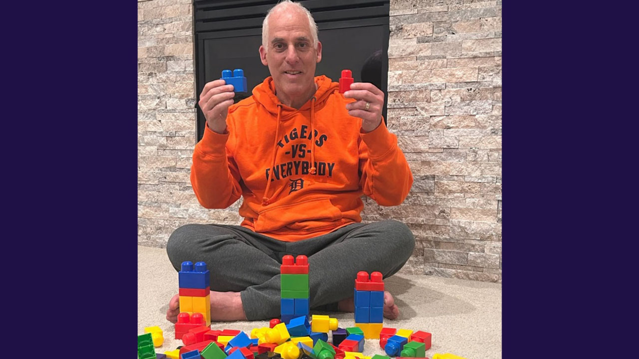 Rabbi Josh Bennett of Temple Israel in Detroit holds Lego blocks, urging families to add the children’s toy to their Seder plates in the wake of a recent attack on the synagogue. (Facebook)