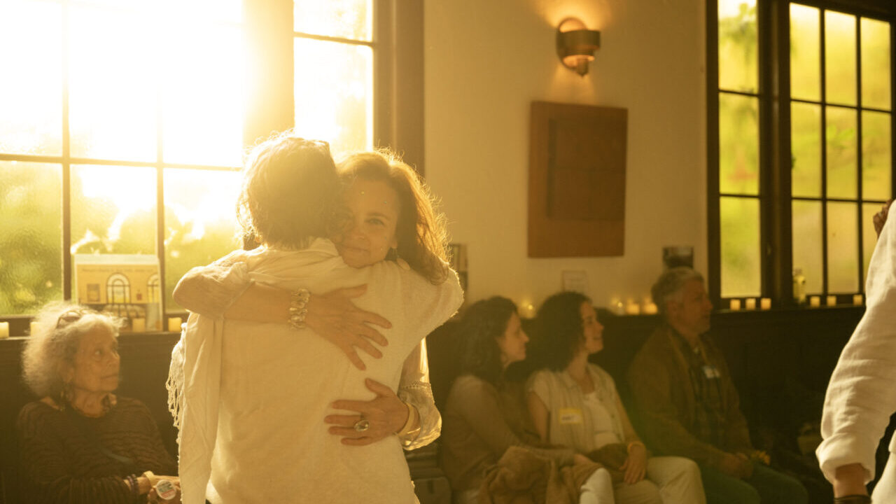A pair embrace during an all-night event celebrating Shavuot at Renewal congregation Chochmat HaLev in Berkeley, June 1-2, 2025. (Aaron Levy-Wolins/J. Staff)