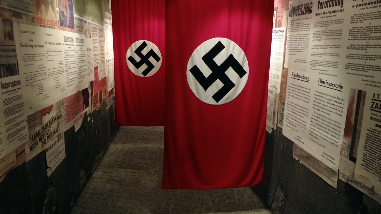 Swastika flags hang in an exhibit at Oskar Schindler's former factory in Krawkow, Poland. (Adam Jones via Flickr CC BY 2.0)