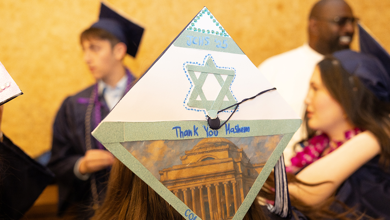 “Thank You HaShem,” reads the decorated top of a mortarboard at Jewish Community High School of the Bay Class of 2025's graduation ceremony. (Lisa Duncan)