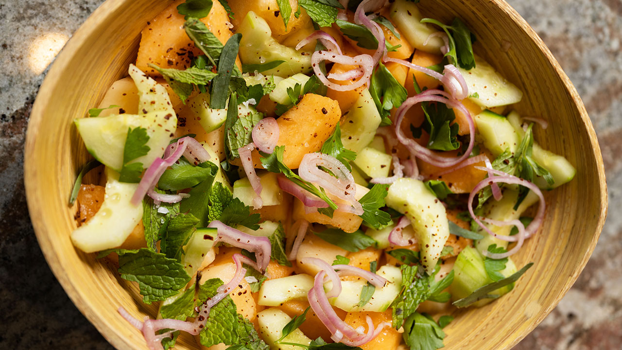 This Muskmelon Salad with Cucumbers, Shallots and Garden Herbs is adapted from “Full Belly Farm & Kitchen.” (Aaron Levy-Wolins/J. Staff)