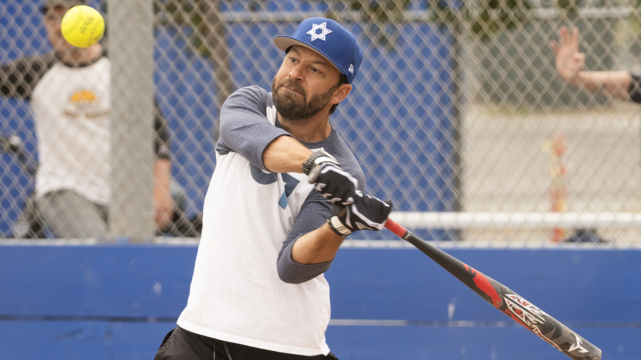 Greg Berguig hits a two-run homer as the Brandeis/Sherith Israel Lionhearts play the Kol Shofar Maccabees during a softball game at the Tamalpais High School softball field in Mill Valley, June 14, 2026. (Aaron Levy-Wolins/J. Staff)