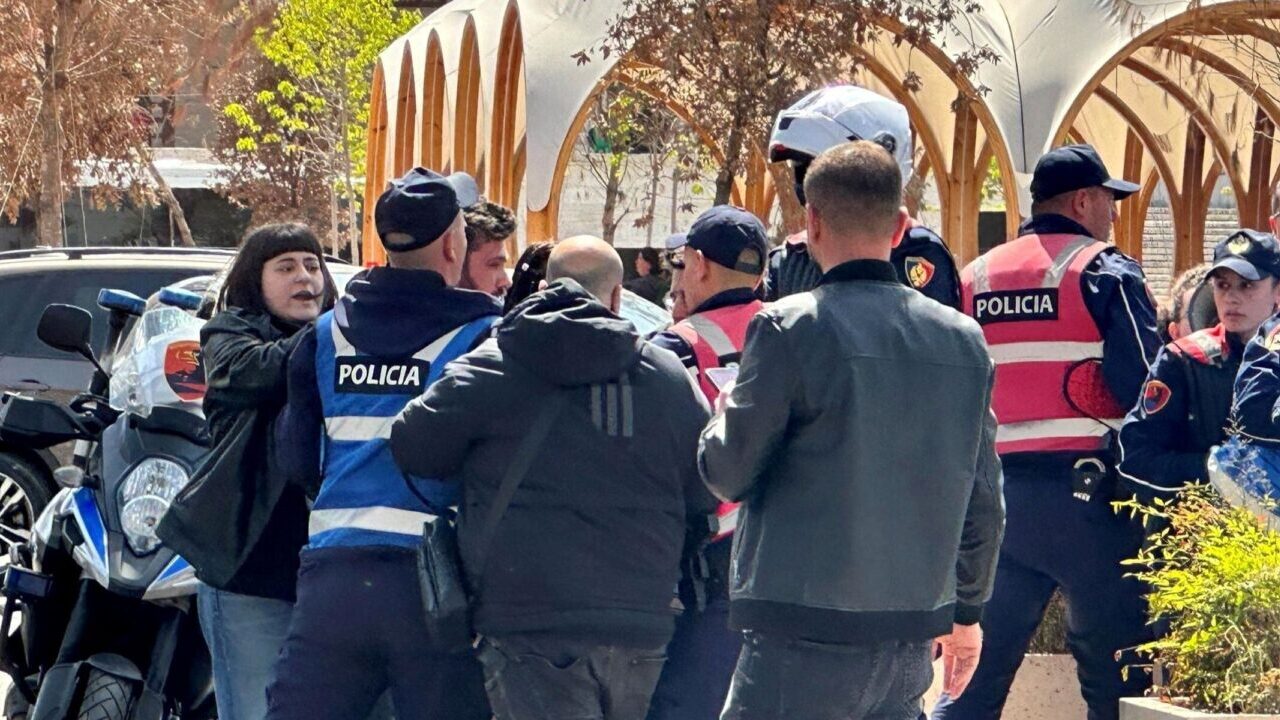 Police attempt to detain protesters opposed to Albanian Prime Minister Edi Rama in front of a government building in Tirana, Albania, June 2026. (Larry Luxner)