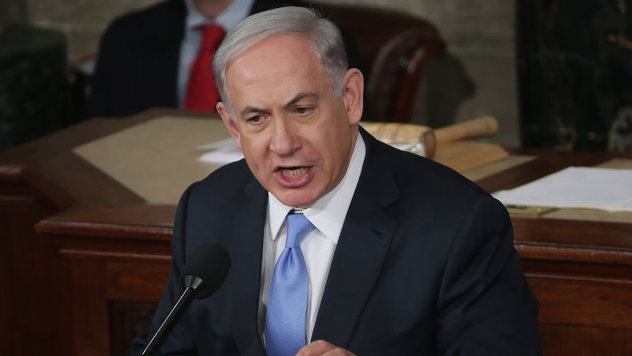 Israel Prime Minister Benjamin Netanyahu urges lawmakers to reject the Iran nuclear deal during a joint meeting of Congress in the House chamber at the U.S. Capitol, March 3, 2015. (Alex Wong/Getty Images)