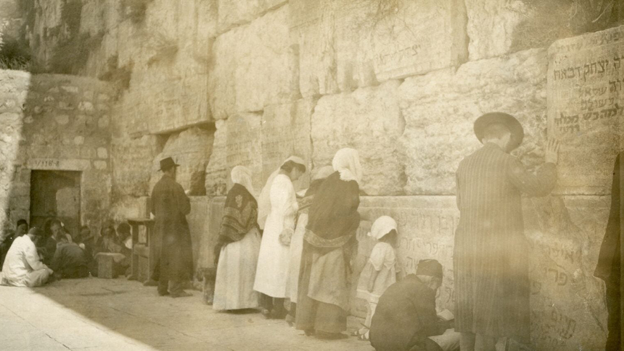 Abraham Orkin Freedman's photograph of the Western Wall from 1921 showed men and women praying together at the Jewish holy site. (Courtesy Tower of David Jerusalem Museum)