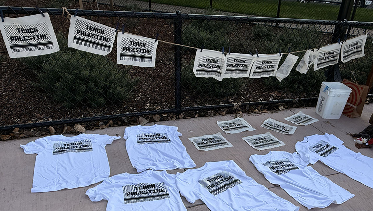 A “Teach Palestine” banner and T-shirts are strung from a fence and strewn on the ground as Berkeley High School students rally in Martin Luther King Jr. Civic Center park after they walked out of class to protest Israel's conduct in Gaza, Jan. 27, 2026. (Niva Ashkenazi/J. Staff)