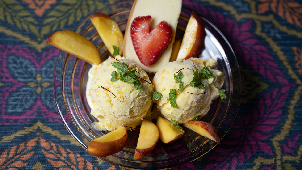 Spiced Peach Frozen Yogurt can be served with sliced peaches and strawberries, with pound cake on the side. (Aaron Levy-Wolins/J. Staff)